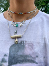 Load image into Gallery viewer, How the bad a** necklace fits
